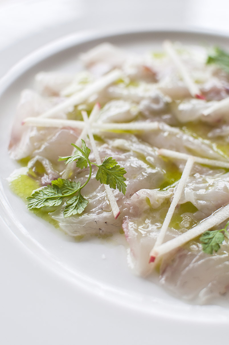 photo shows a plate of ceviche of sea bass, apple and verbena, prepared by chef Jack Stein