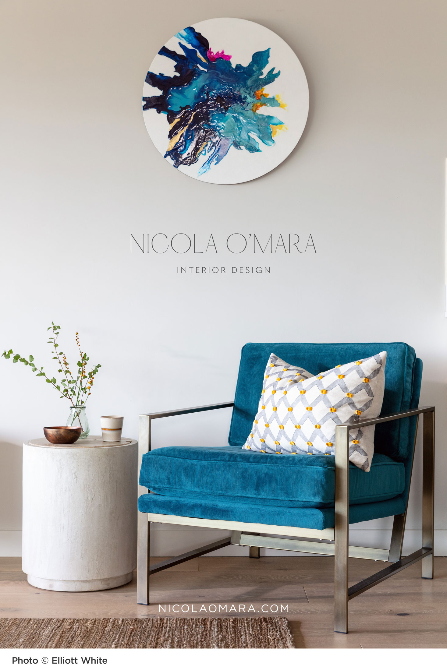 poster design for Nicola O'Mara Interior Design featuring a photo of a living space with blue velvet chair and contemporary artwork